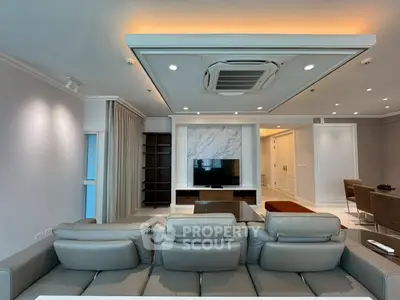 Luxurious modern living room with elegant ceiling design and stylish furniture