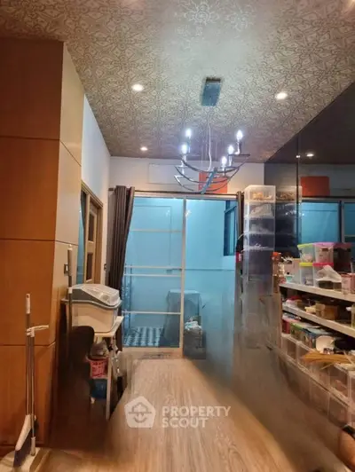 Spacious storage room with modern lighting and ample shelving.