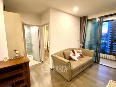 Modern living room with cozy sofa and balcony view in urban apartment