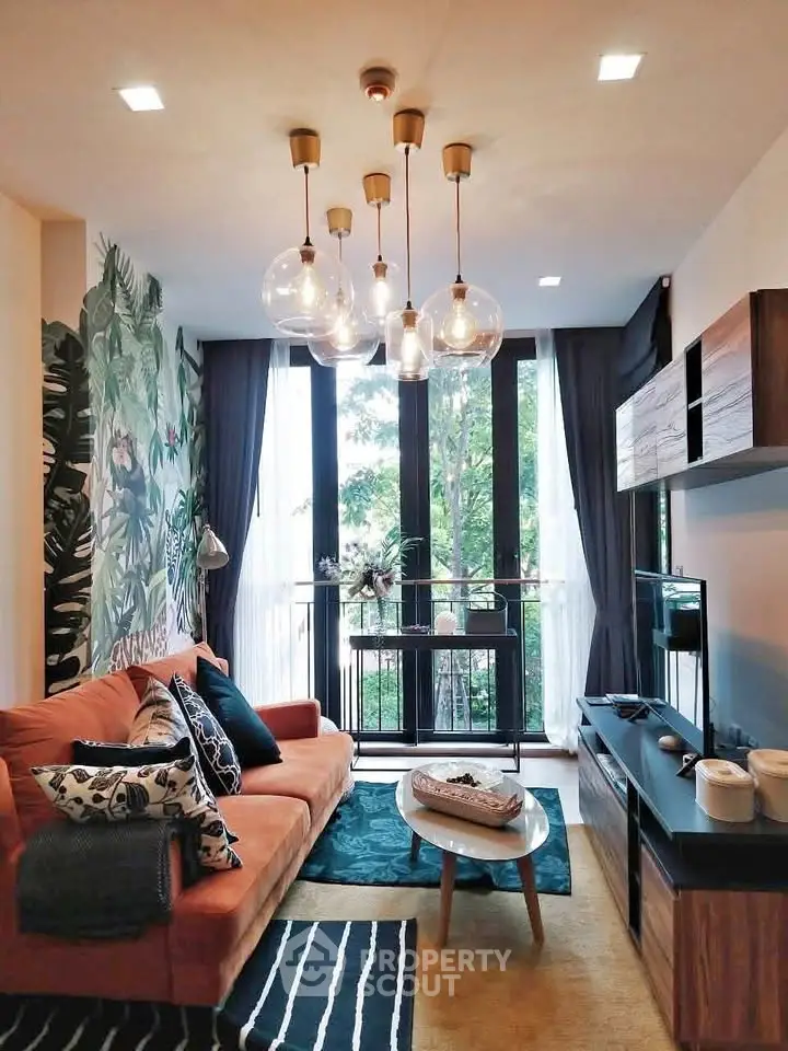 Stylish living room with modern decor, large windows, and elegant lighting in a cozy apartment.