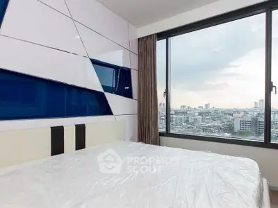 Modern bedroom with large window offering stunning cityscape view, featuring sleek geometric wall design.