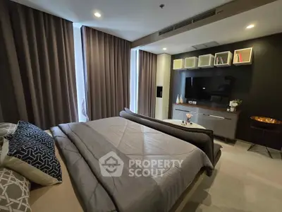 Luxurious modern bedroom with stylish decor and ample natural light