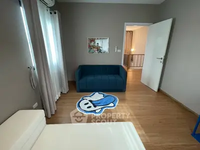 Cozy living room with modern decor and stylish blue sofa