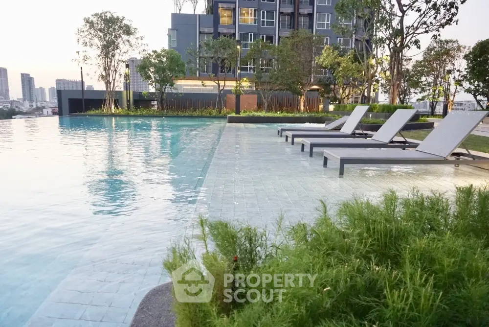 Luxurious apartment complex with stunning poolside view and modern amenities