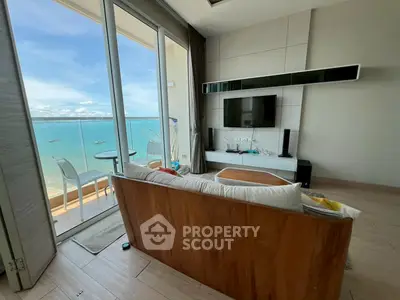 Stunning living room with ocean view and modern decor in beachfront property
