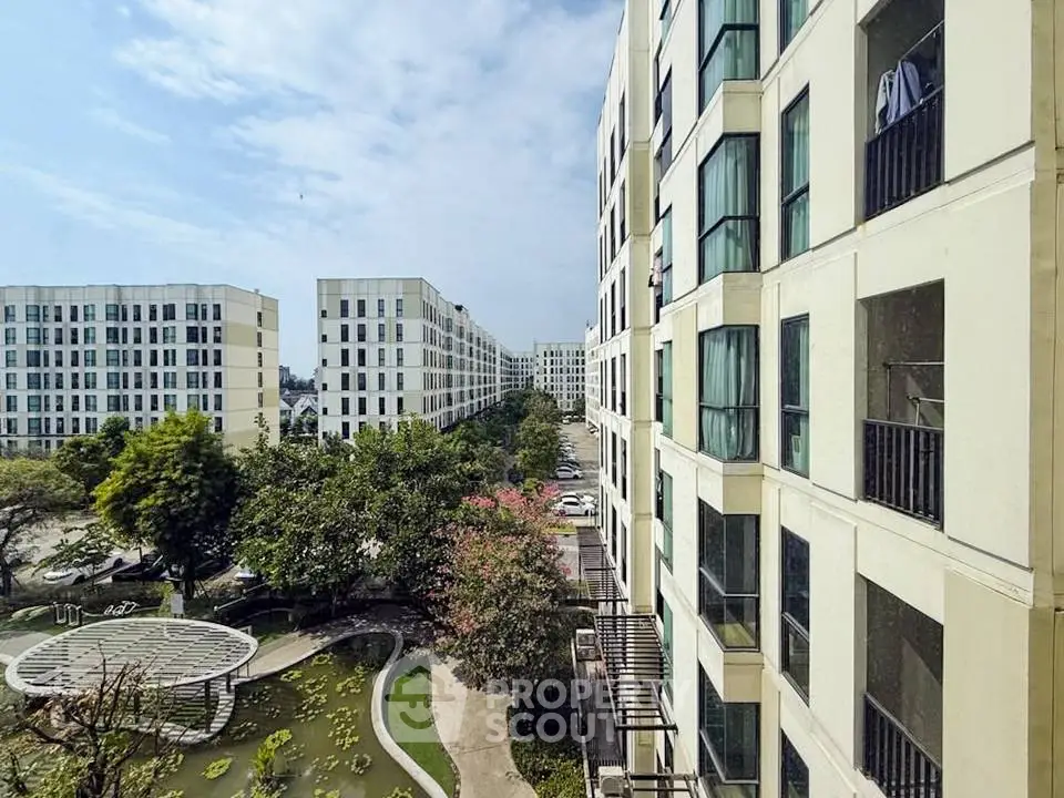 Modern apartment complex with lush gardens and scenic views