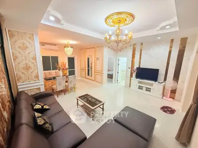 Luxurious living room with elegant chandelier and modern decor