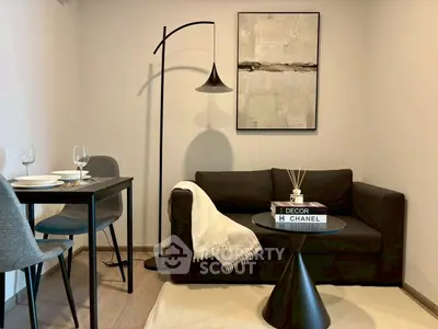 Modern living room with stylish decor, cozy sofa, and elegant dining area, perfect for urban living.