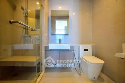 Modern bathroom with glass shower and sleek fixtures