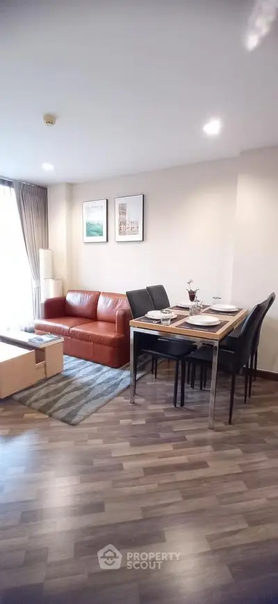 Modern living room with stylish furniture and dining area in open layout apartment