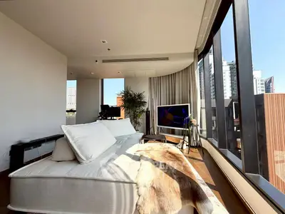 Luxurious modern living room with panoramic city views and stylish decor