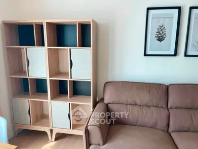 Cozy living room with stylish shelving and comfortable brown sofa, perfect for modern living.