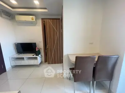 Modern living room with sleek furniture and air conditioning, perfect for comfortable living.