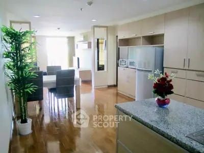 Spacious open-layout kitchen and dining area with modern appliances and elegant decor.