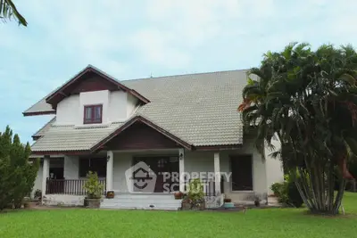 Charming suburban house with lush garden and spacious porch, perfect for family living.