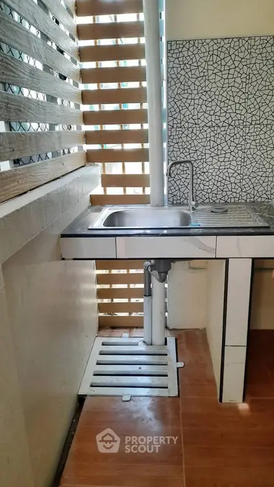 Charming kitchen corner with modern sink and stylish backsplash tiles