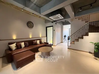 Spacious modern living room with stylish decor and cozy seating area