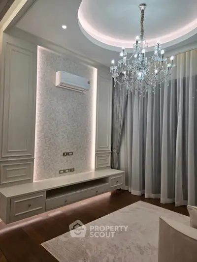 Elegant living room with chandelier and modern decor