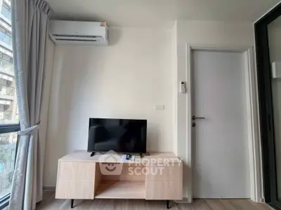 Modern living room with sleek TV stand and air conditioning unit