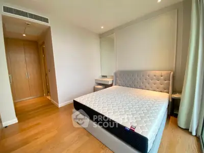Spacious bedroom with modern design and large bed in a stylish apartment.
