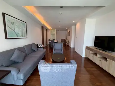Spacious living room with modern furniture and elegant wooden flooring
