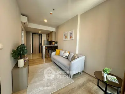 Modern living room with stylish decor and cozy ambiance in a contemporary apartment.