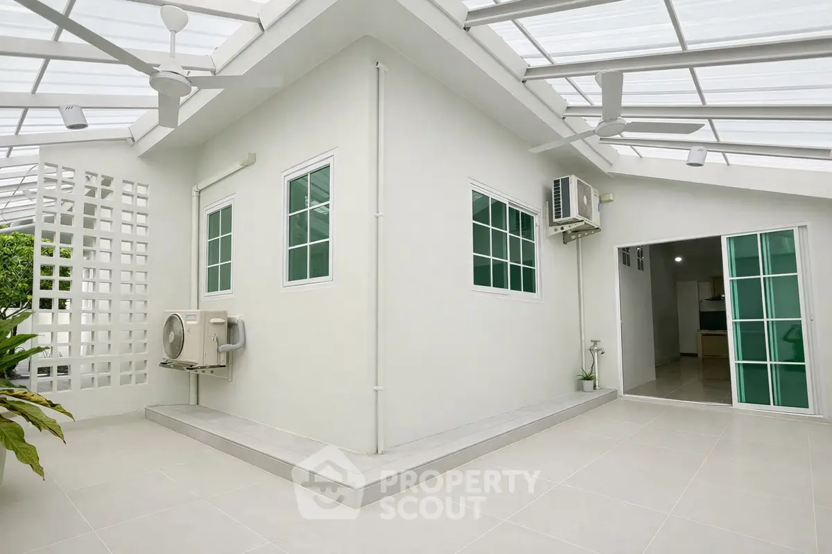 Modern rooftop terrace with sleek design and air conditioning unit