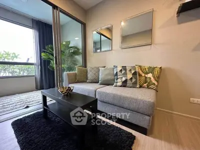 Stylish living room with modern decor and large windows for natural light