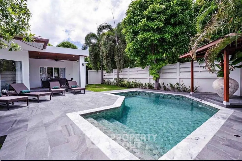 Luxurious villa with private pool and lush garden, perfect for relaxation and entertaining.