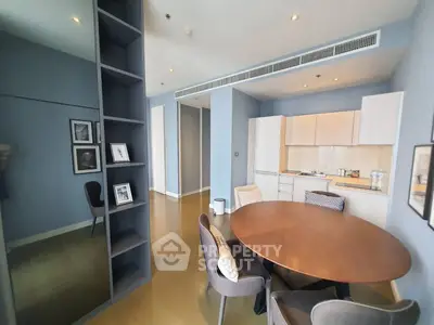 Modern open-layout kitchen and dining area with stylish decor and ample natural light.