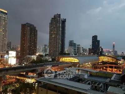 Stunning cityscape view with modern high-rise buildings and a bustling urban skyline at dusk.