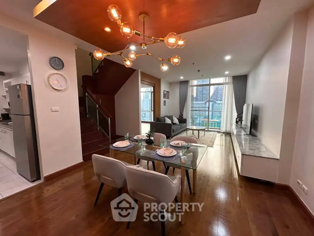 Modern living room with dining area and city view, featuring stylish lighting and open layout.