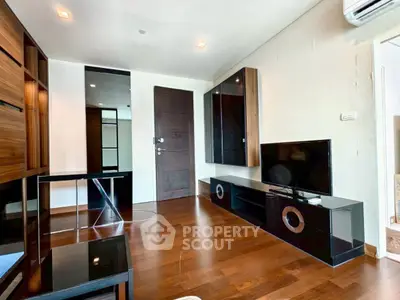 Modern living room with sleek furniture and wooden flooring