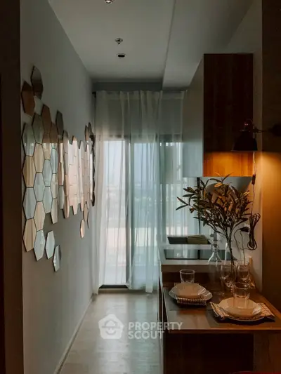 Stylish kitchen with modern decor and natural light, featuring hexagonal wall art and elegant table setting.