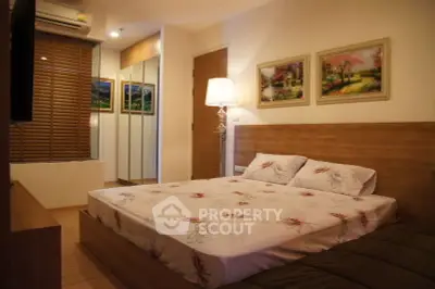 Cozy bedroom with wooden accents, large bed, and elegant decor in a modern apartment.