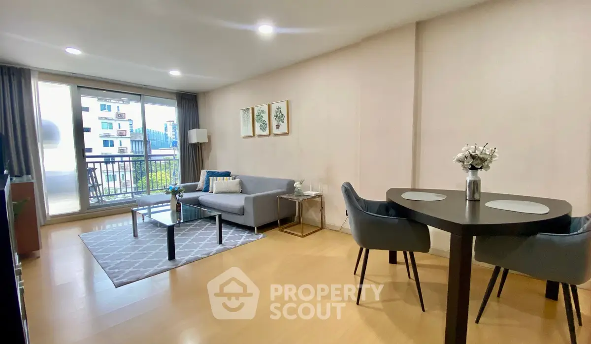 Spacious modern living room with balcony view and elegant decor