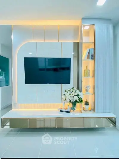 Modern living room with sleek TV unit and ambient lighting