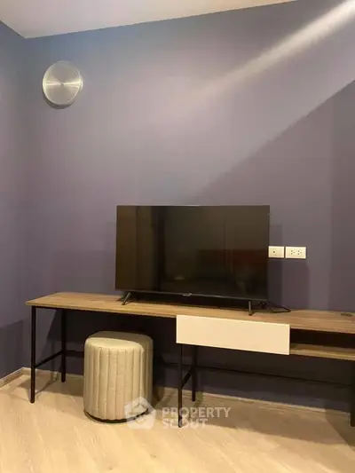 Modern living room with sleek TV setup and stylish decor