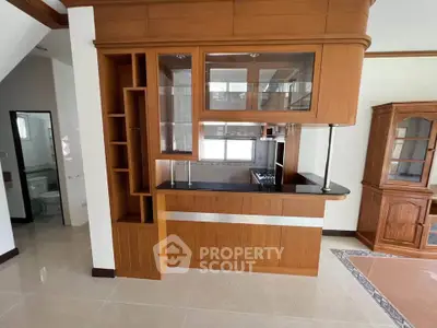 Spacious kitchen with wooden cabinetry and open layout design