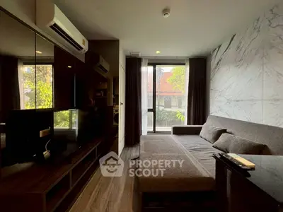 Modern living room with sleek design and large window view