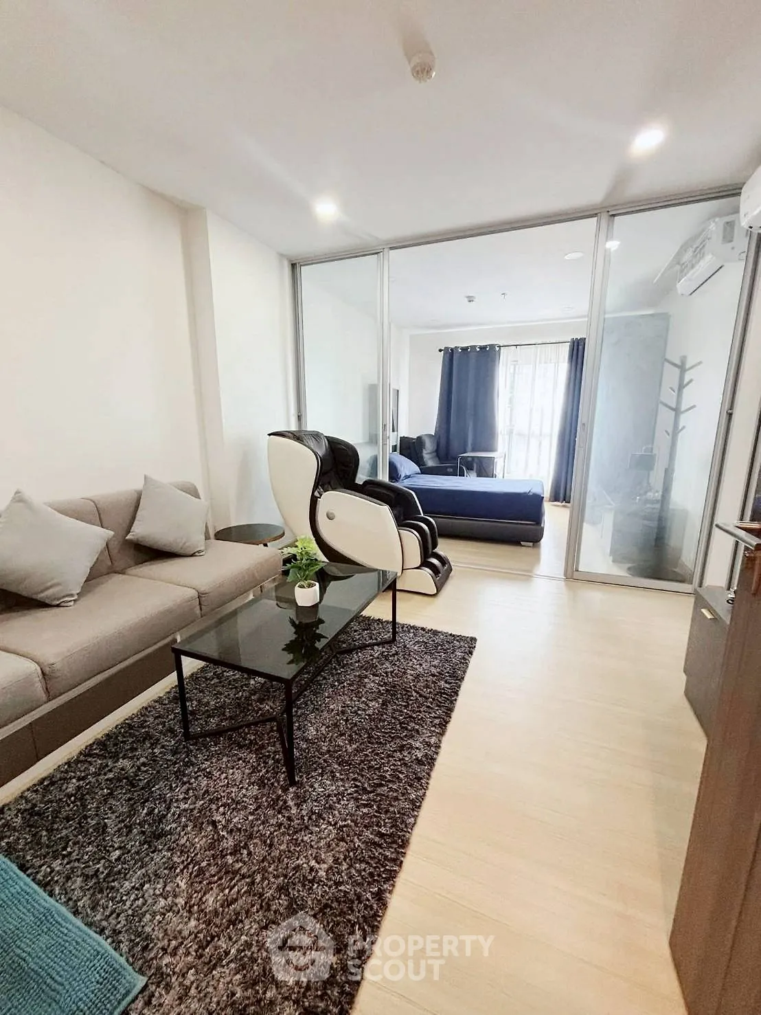 Modern living room with cozy sofa and stylish decor in open layout apartment