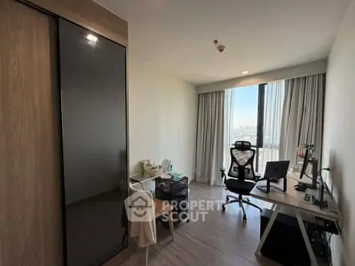 Modern study room with city view, featuring sleek desk and ergonomic chair, ideal for productivity.