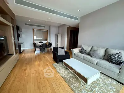 Spacious living room with modern furniture and wooden flooring