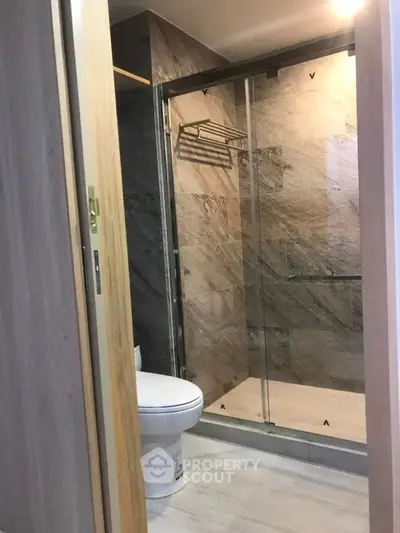 Modern bathroom with glass shower enclosure and sleek design