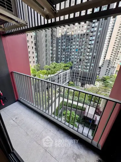 Modern urban balcony with cityscape view and lush greenery