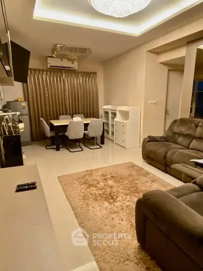 Luxurious living room with plush seating and elegant dining area, perfect for modern living.
