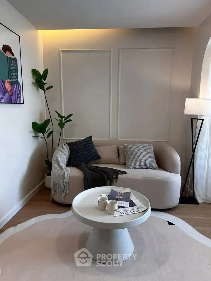 Stylish modern living room with cozy sofa, elegant decor, and soft lighting