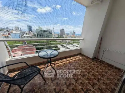 Spacious balcony with stunning city view, perfect for relaxation and enjoying the skyline.