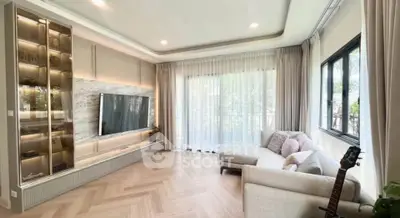 Spacious modern living room with large windows and elegant decor