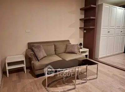 Cozy living room with modern sofa and stylish coffee table in elegant apartment.